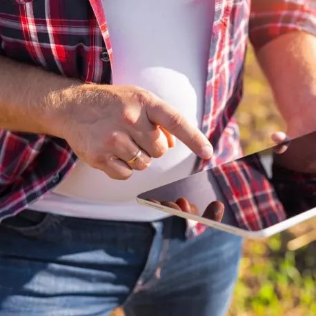 guy in field with tablet